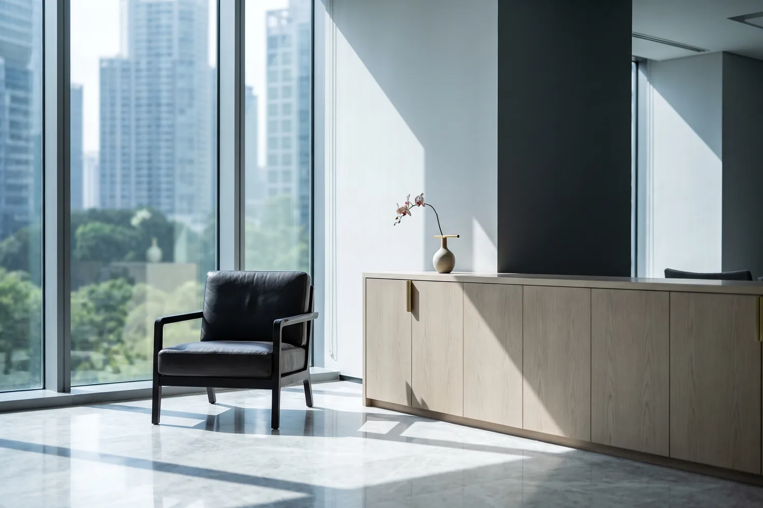 A calm, light-filled executive interior with a single chair and a long timber table